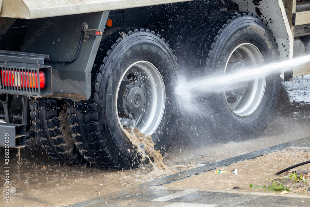 Pressure washing truck wheels